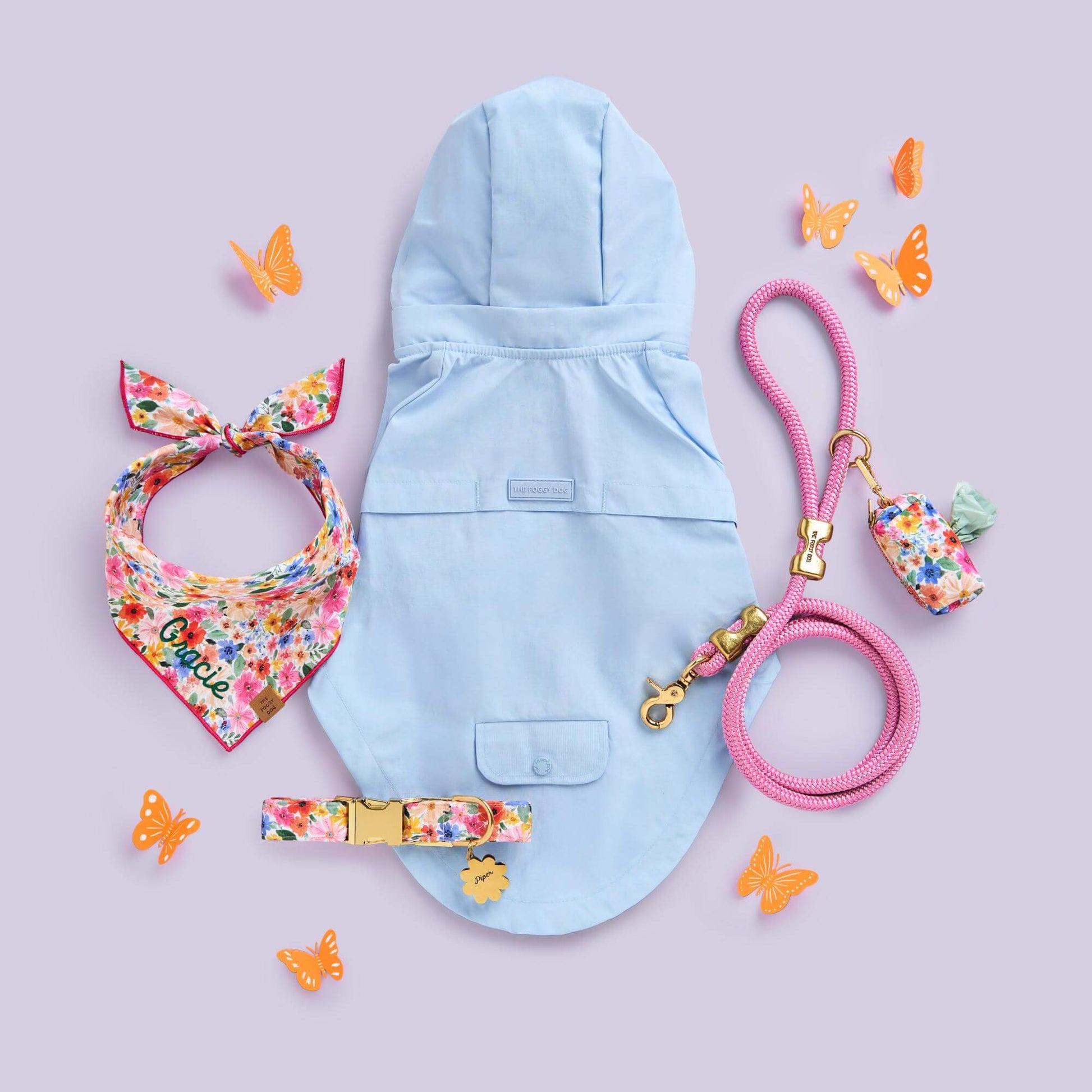 Sky Blue Raincoat, Margaux Collar Walk Set, Bandana, Waste Bag Holder, Orchid Marine Rope Dog Leash and Flower Pet ID Tag from The Foggy Dog