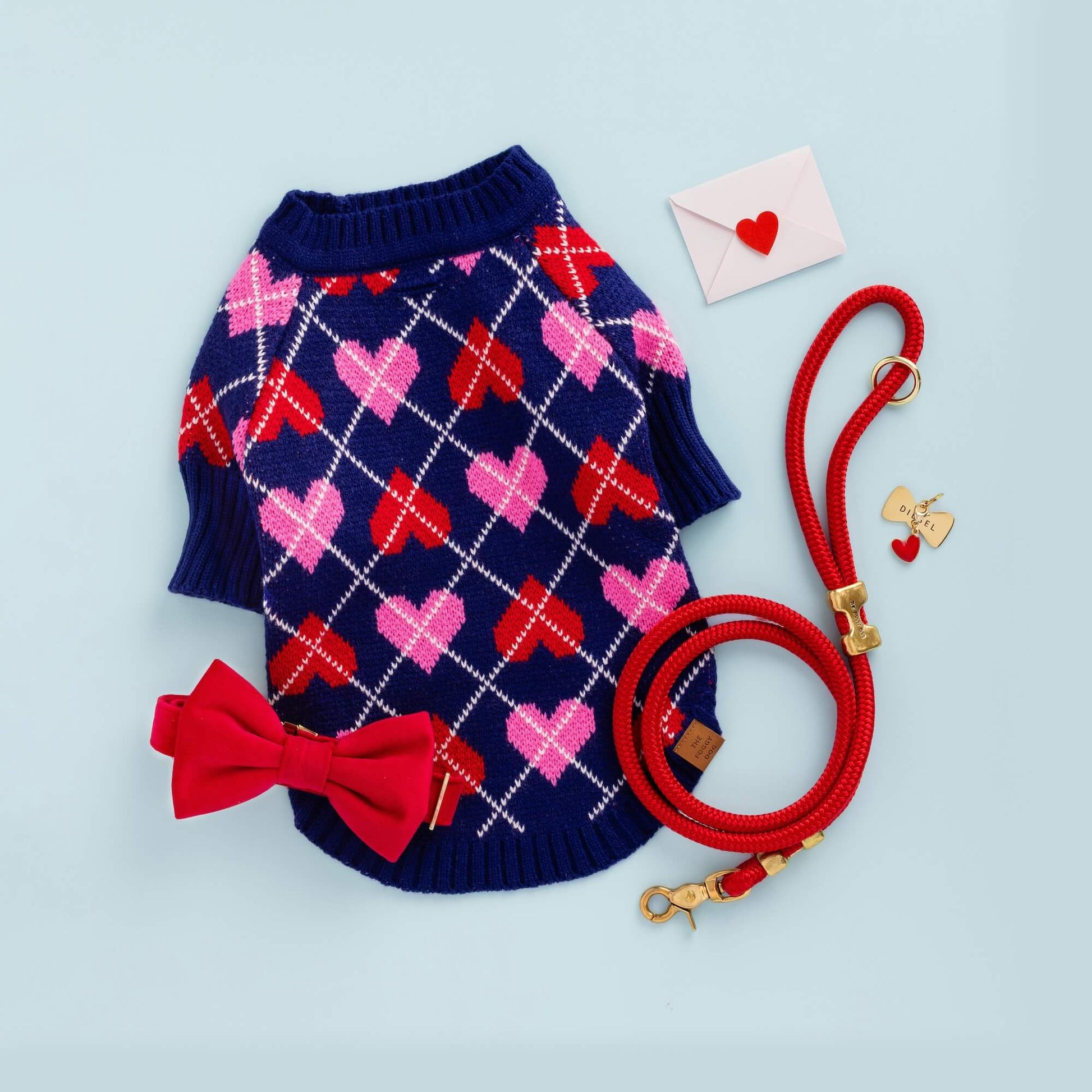 Heart Argyle Dog Sweater, Ruby Bow Tie Collar, Ruby Marine Rope Leash, Bow Tie ID Tag, and Red Heart Charm from The Foggy Dog