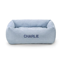 Lake Blue Stripe Bolster Dog Bed from The Foggy Dog