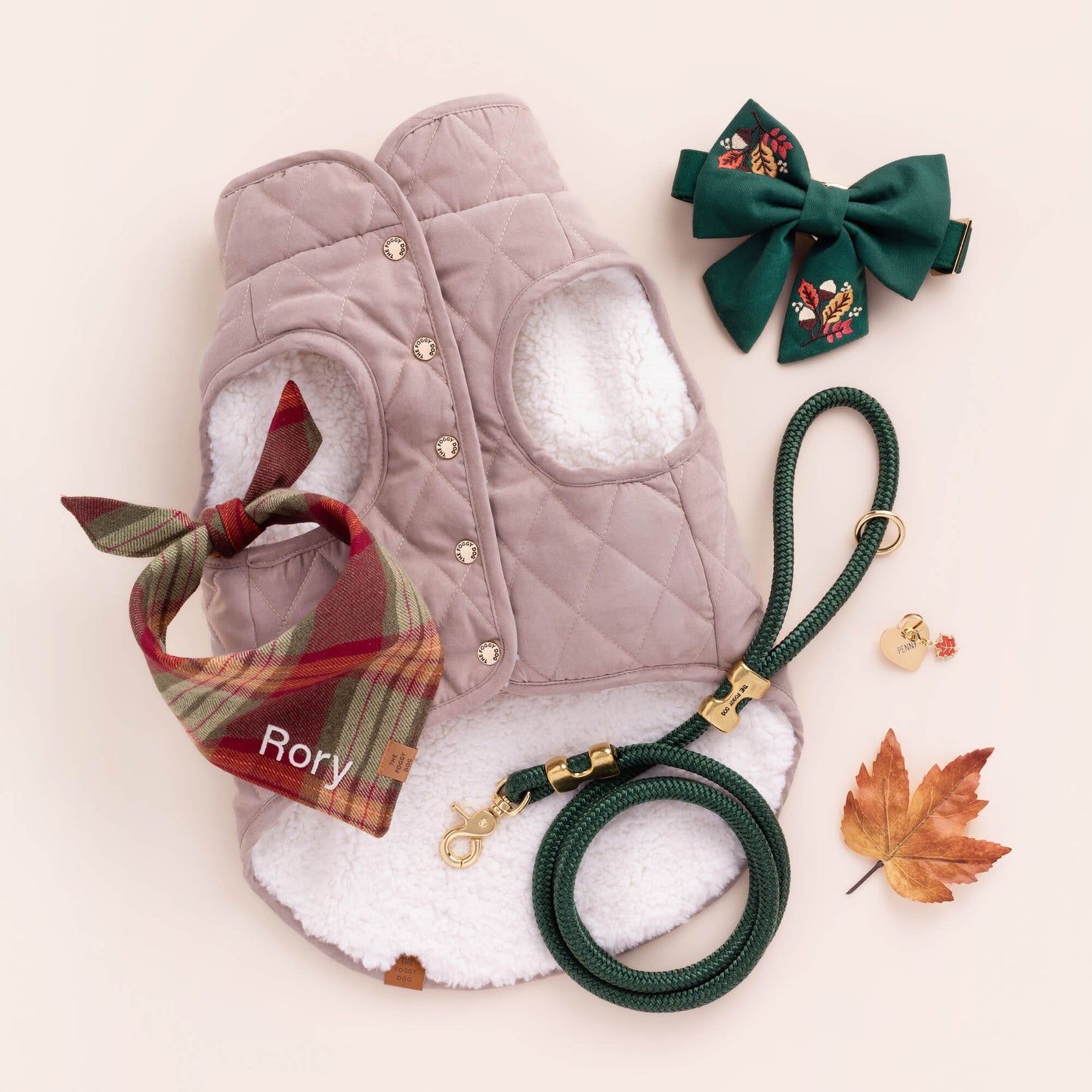 Fawn Sherpa-Lined Reversible Dog Jacket, Fall Foliage Embroidered Lady Bow Collar, Fall Foliage Lady Dog Bow, Evergreen Marine Rope Leash, and Orchard Plaid Flannel Dog Bandana from The Foggy Dog